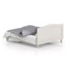 Wooden Bed with Grey Bedclothes