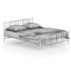 Metal Bed with Striped Bedclothes