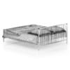 Metal Bed with Striped Bedclothes