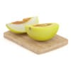 Halved Yellow Melon on Wooden Board