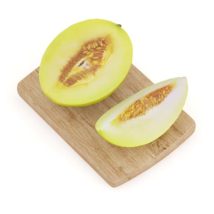 Halved Yellow Melon on Wooden Board