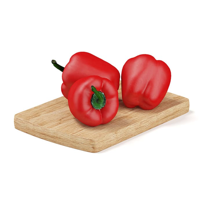 Red Peppers on Wooden Board