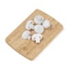 Sliced Mushrooms on Wooden Board
